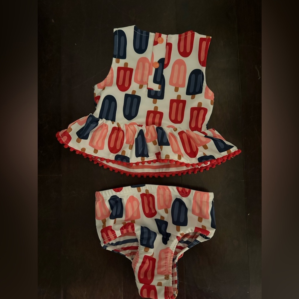 GIRLS' MUDPIE POPSICLE AND STRIPE SWIMSUIT SET- 3-6 MONTHS
Reversible pattern